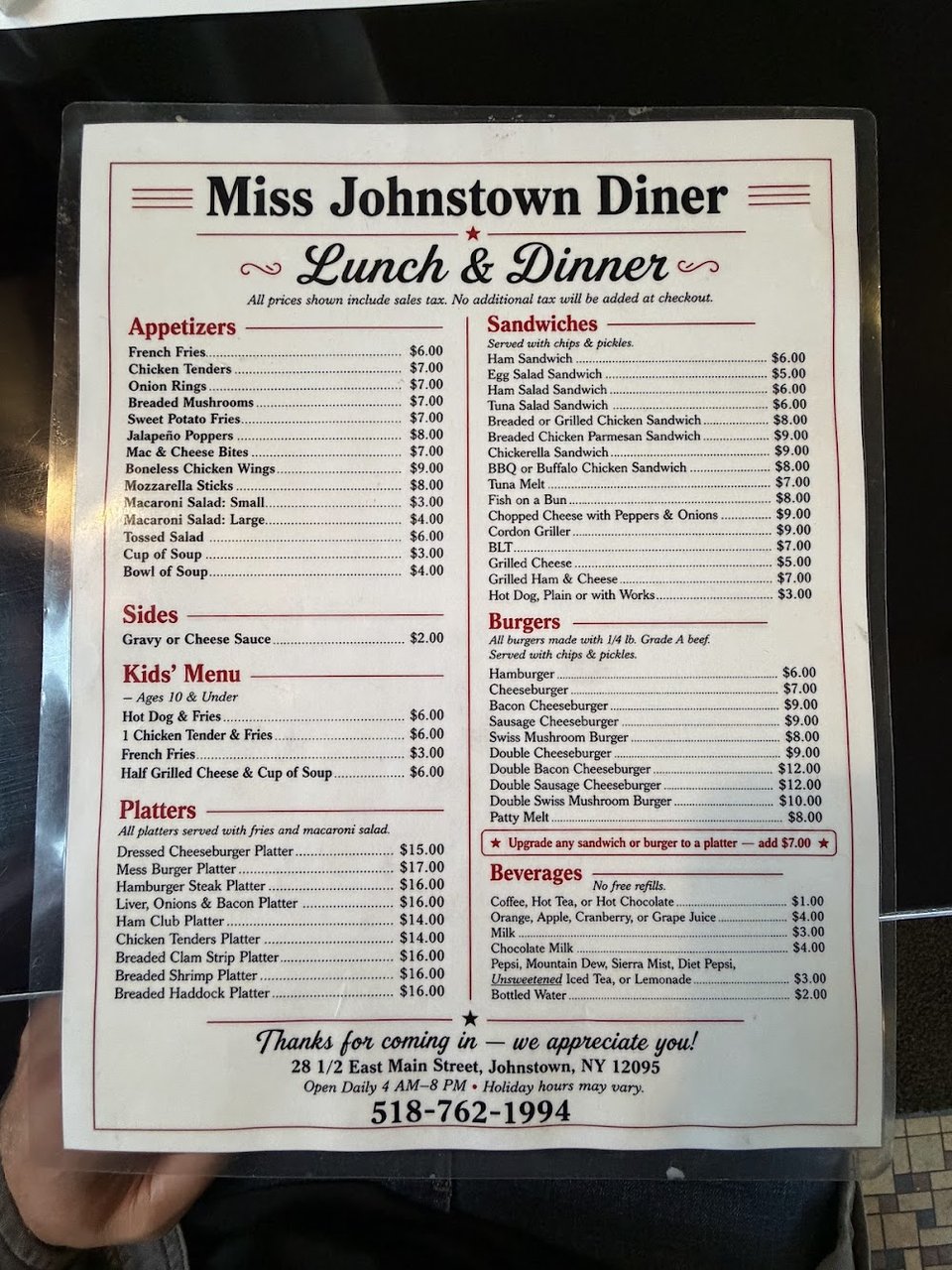 Menu page showing omelets and home fries